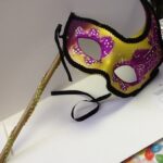 A Masquerade Mask Gold Purple on dowel